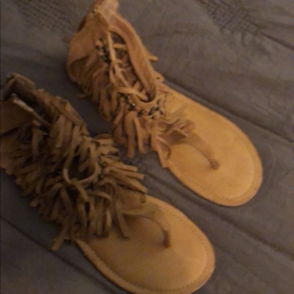 Not rated fringe moccasin sandals